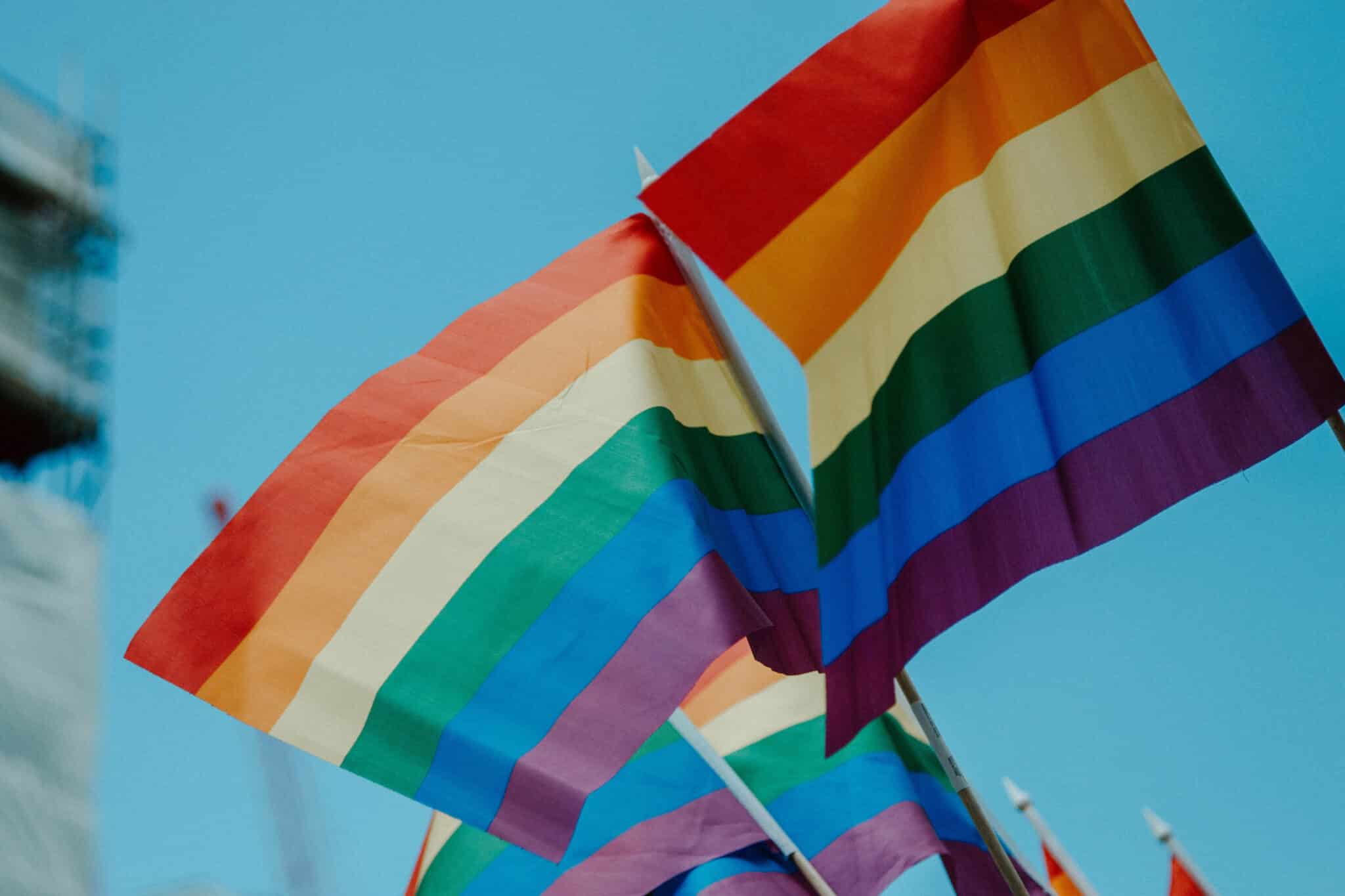 Three rainbow flags