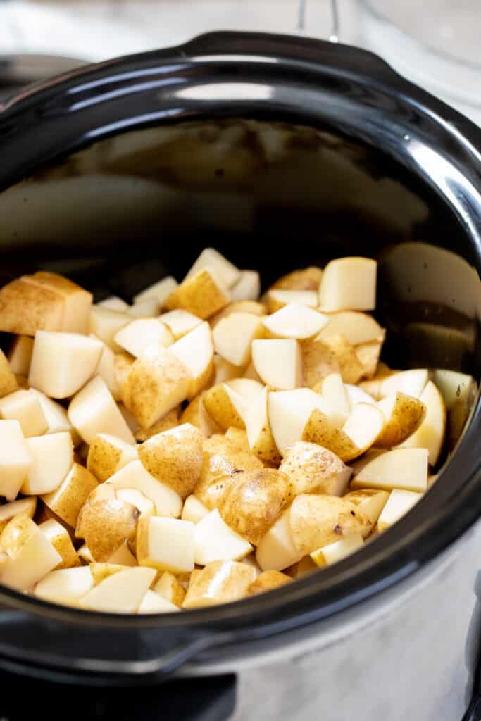 Potato cubes in a slow cooker.