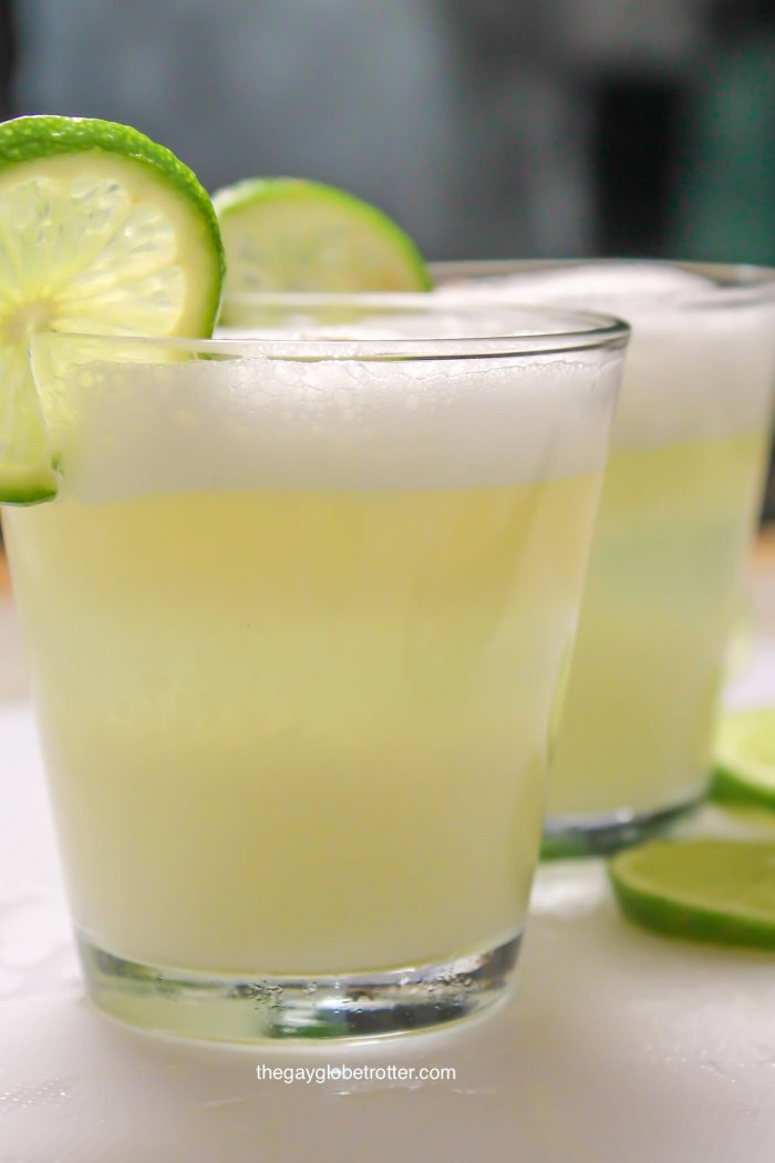 Peruvian pisco sour cocktails on a cutting board.